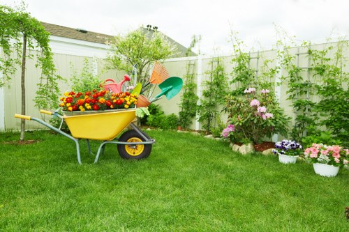 Gardener watering plants using a drip irrigation system