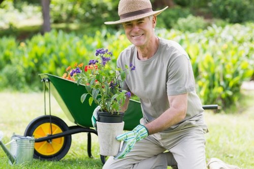 Weed control measures being applied in a pristine Ashburton garden