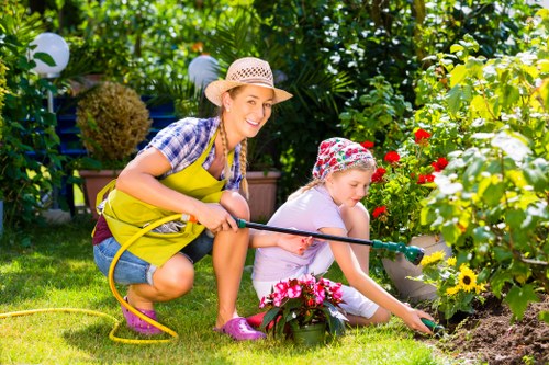 Skilled gardeners working on eco-friendly garden practices